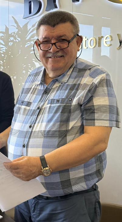 Andranik Ghazarian — Andranik Ghazarian leaving a working meeting with a file.